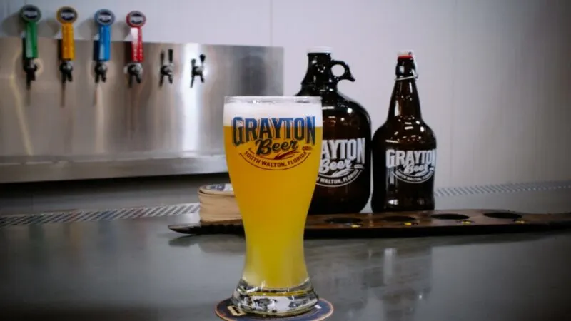 Glass of beer in front of a tap