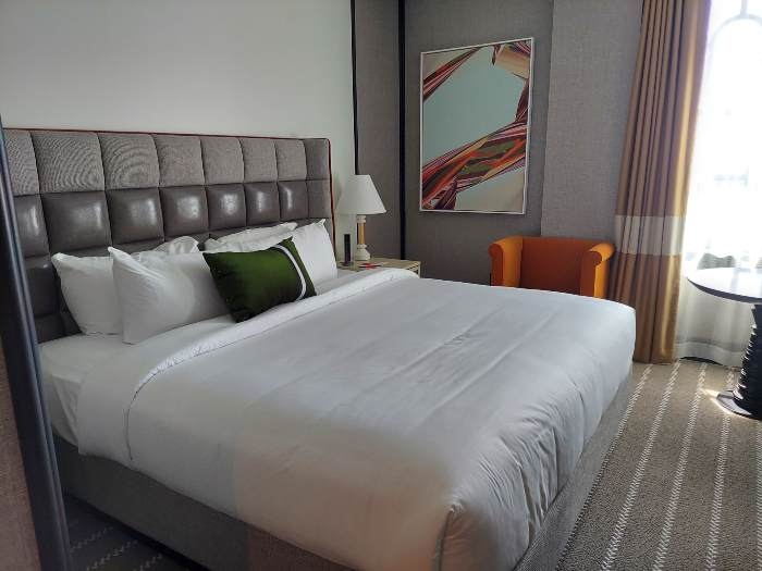 Bed in hotel room at 21c Hotel St. Louis