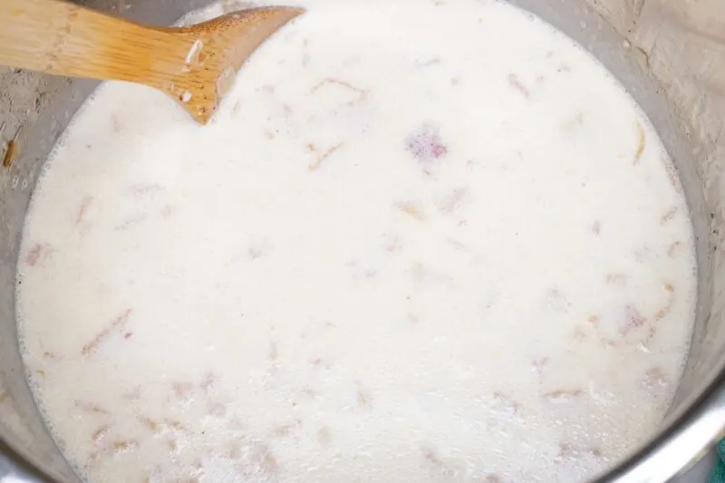 Stirring the finished Clam Chowder soup in the Instant Pot.