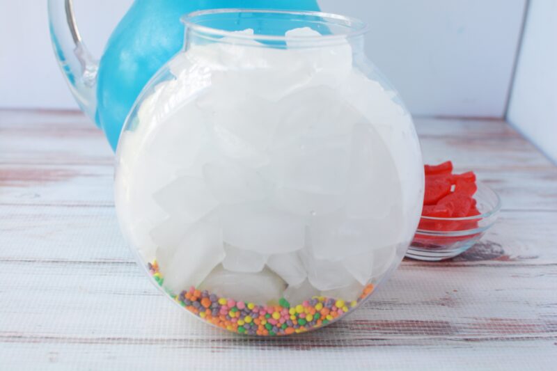 Adding the ice into the fish bowl