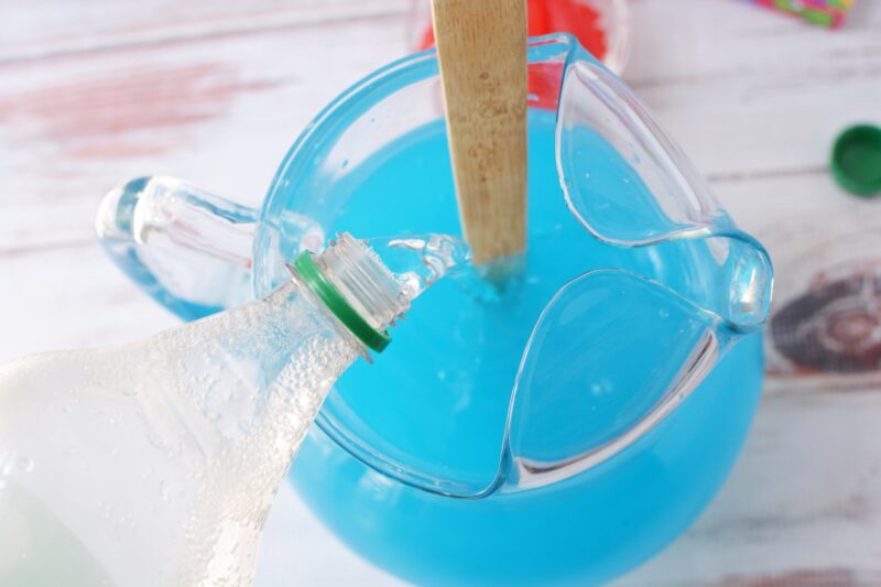 Adding Sprite to the blue non-alcoholic drink mixture