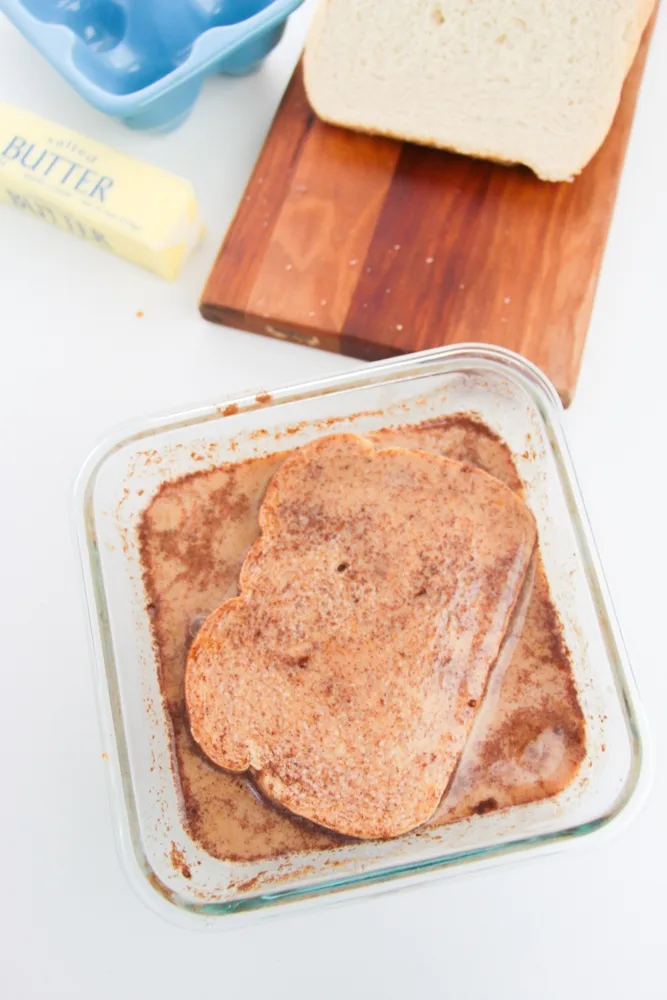 Dipping the bread to soak in the pumpkin custard