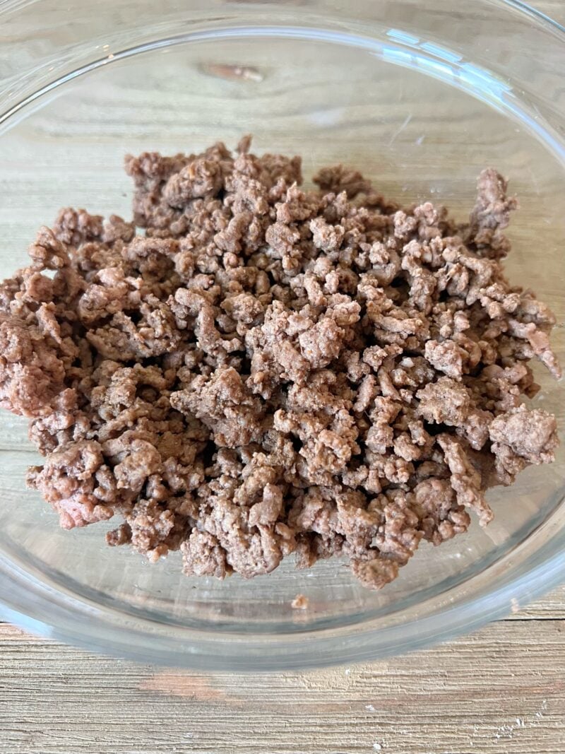 Cooked and browned ground beef with seasoning.