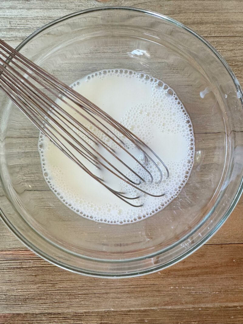 Combining the corn starch and the cream.