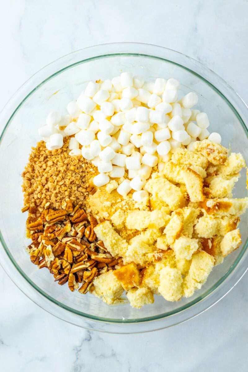 Add in the mix-ins: marshmallows, pecans, pound cake and heath bits.