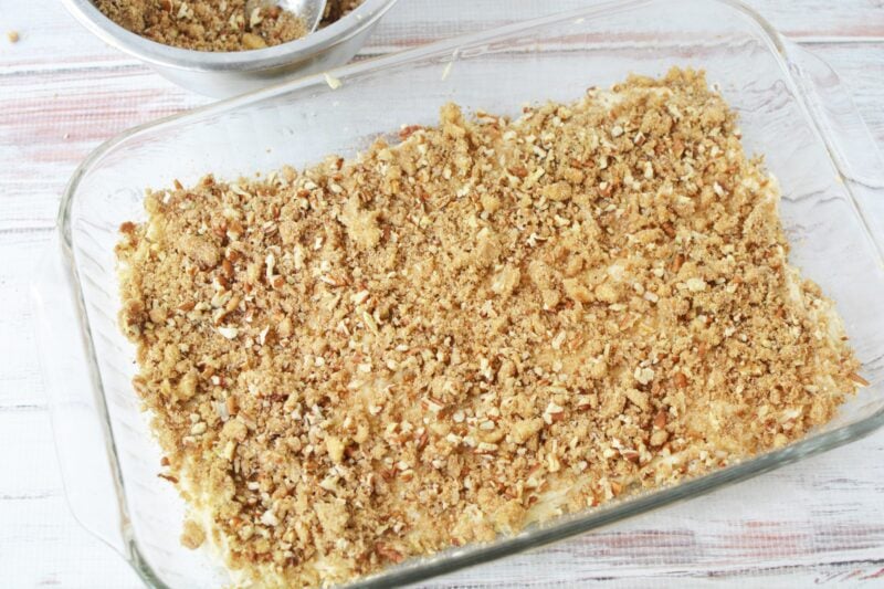 Adding the cake batter base and half of the streusel
