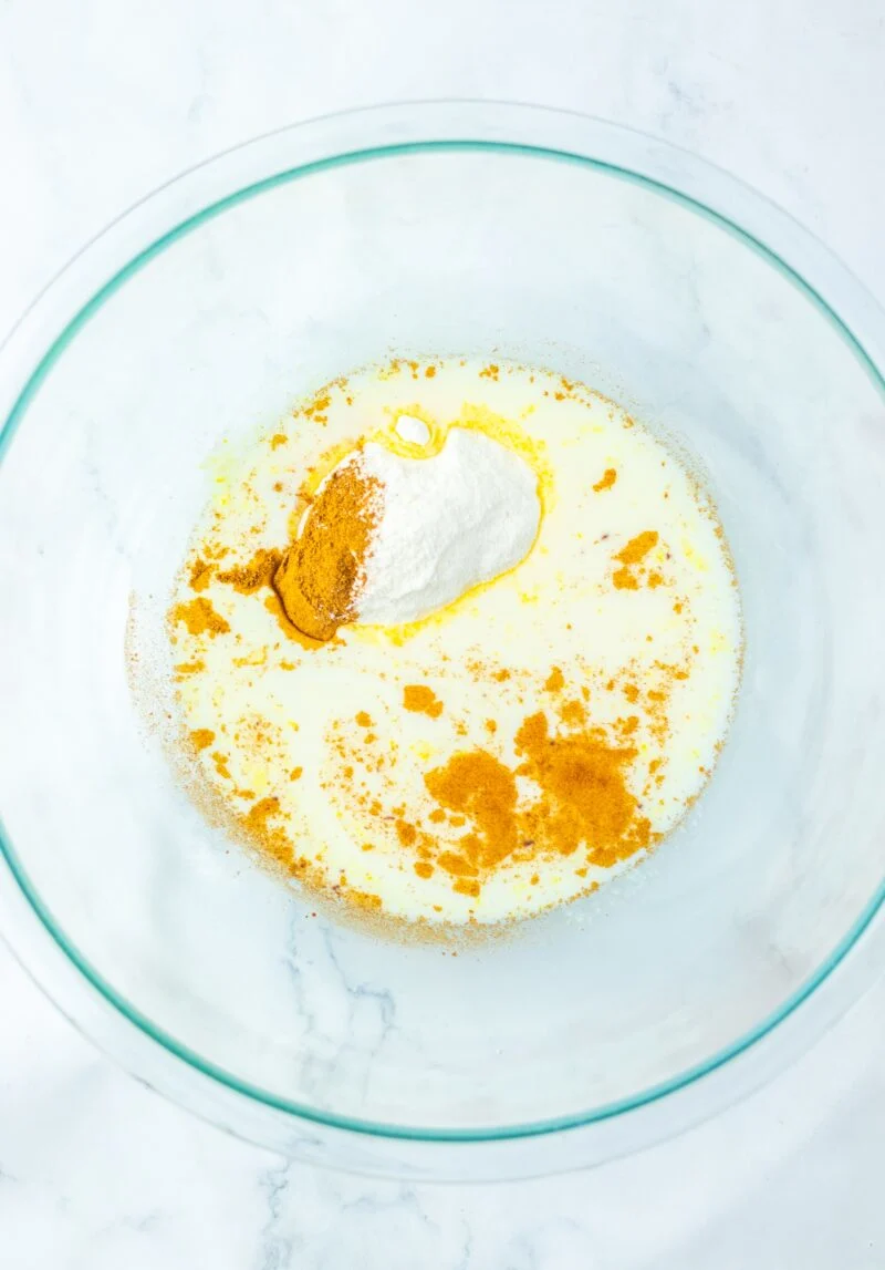 Whisking together the pumpkin pie spice, vanilla pudding and milk.