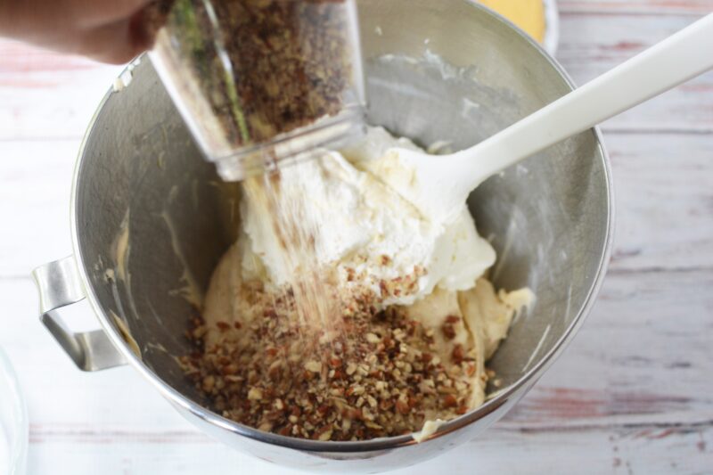 Folding the mixtures together and adding pecans