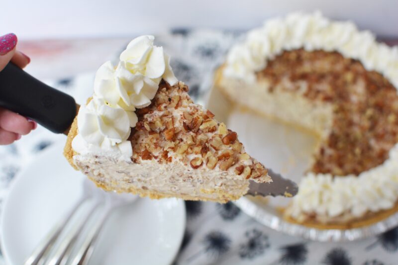 Slice of no-bake creamy pecan pie being served