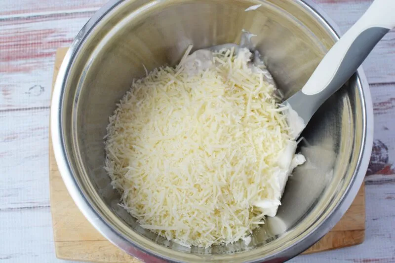 Mixing the Parmesan cheese with the soup and cream cheese