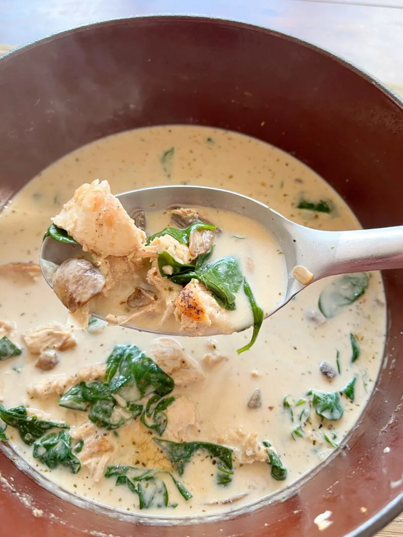 Adding the spinach to finish the soup
