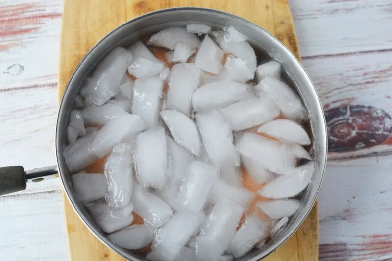 Adding ice to the hard-boiled eggs