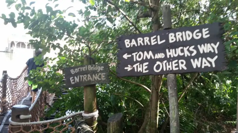 Signs for the Barrel Bridge on Tom Sawyer Island in Walt Disney World.