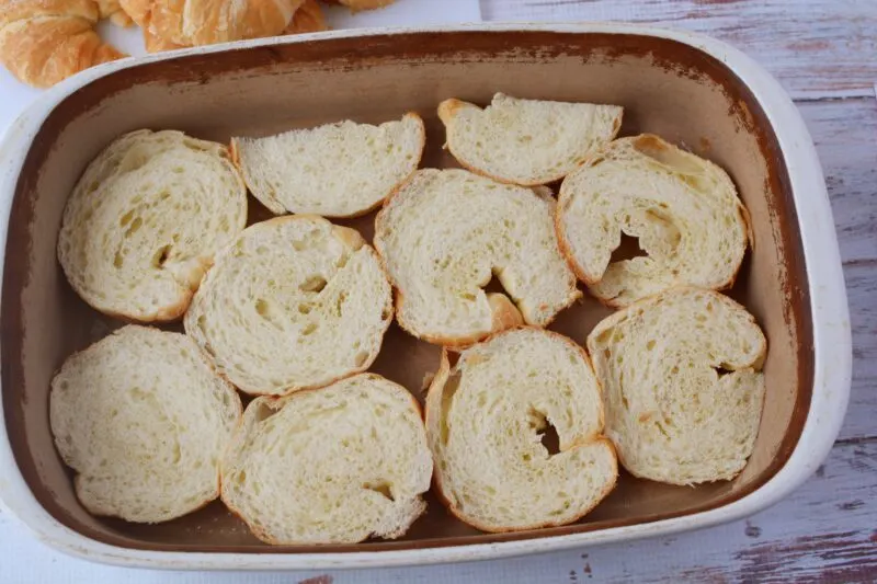 Placing the croissants into the baking dish