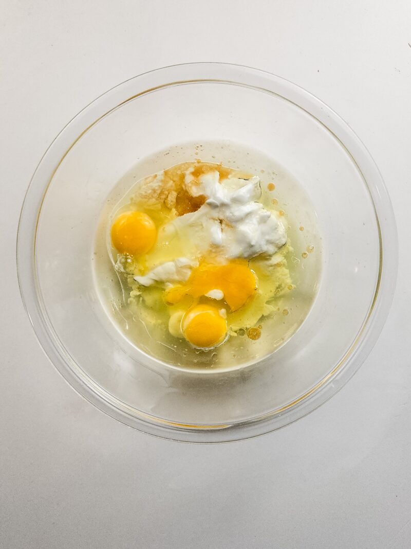 Adding the eggs and yogurt with extracts