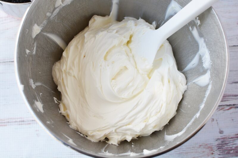 Mixing in the vanilla and the heavy whipping cream