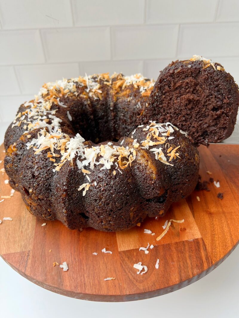 Adding more coconut on top of the cake