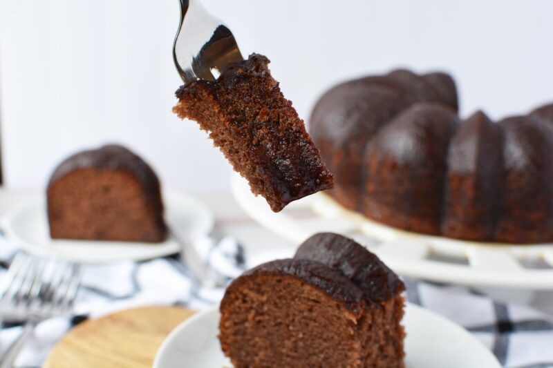 Fork of cake with bundt cake in the background