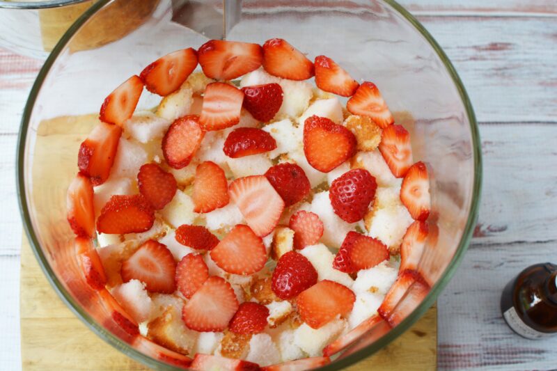 Strawberry trifle recipe, best strawberry trifle recipe, strawberry trifle recipe with alcohol, grand marnier strawberry trifle Adding the cake and strawberry layers