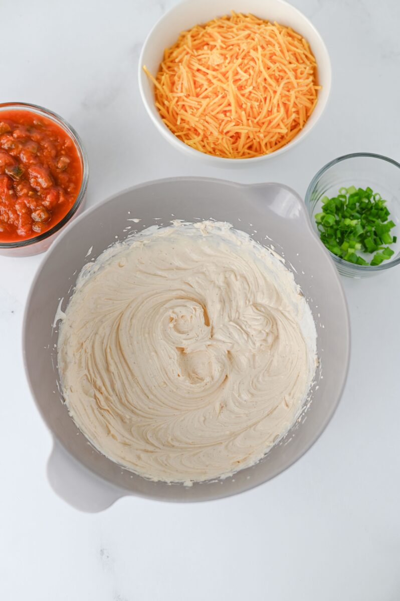 Mixing the cream cheese and the sour cream together