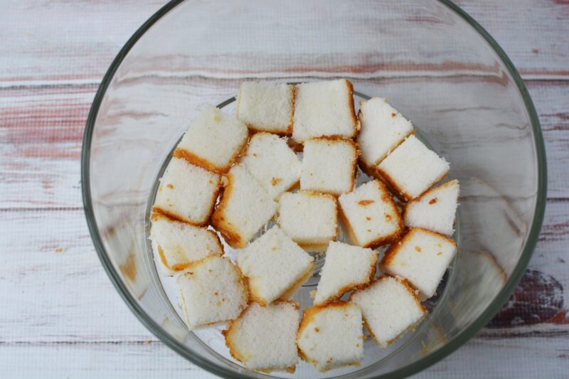 Add the bottom layer of cake to the trifle dish
