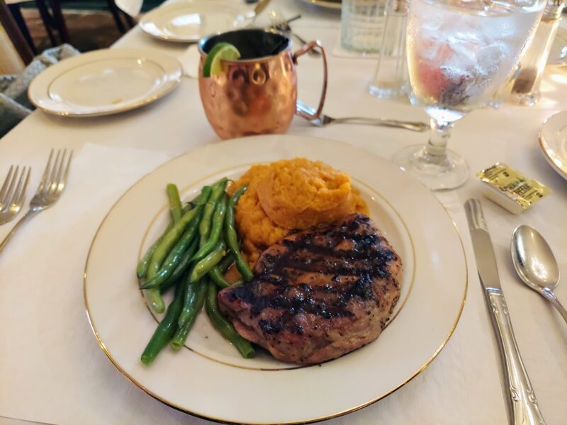 Dinner at Anchuca, a restaurant in Vicksburg, Mississippi. Pictured are pork ribeye, green beans, and sweet potatoes.