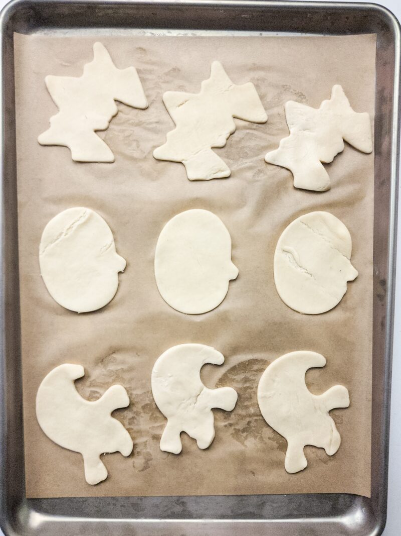 The halloween cutout shapes on the baking sheet