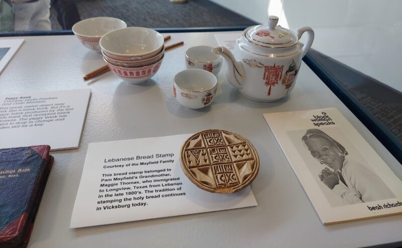 Catfish Row Museum in Vicksburg, Mississippi, highlights the ethnic communities that contributed to Vicksburg. Shown are a pamphlet from actress Beah Richards, a Chinese tea set, and a Lebanese bread stamp. 