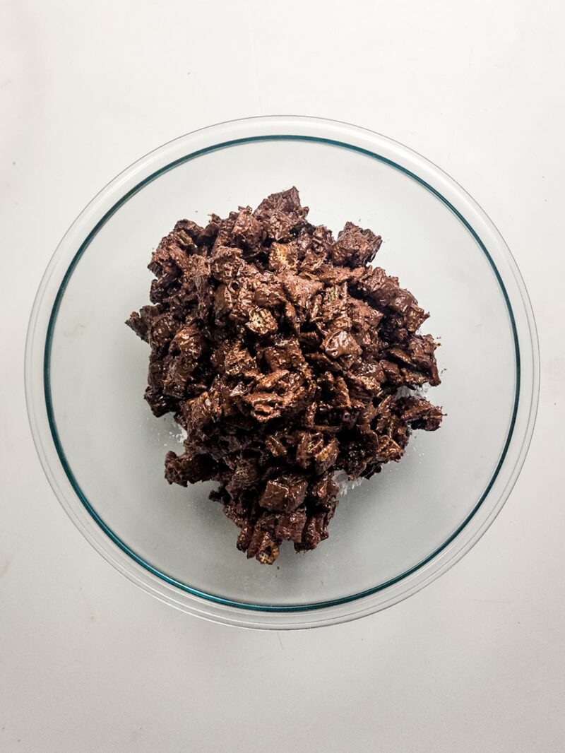 Coating the cereal in the milk chocolate peanut butter mixture