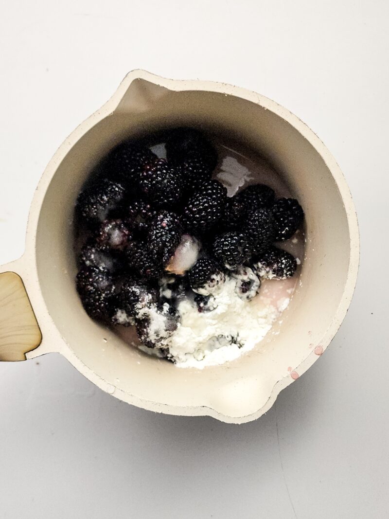 Mixing the blackberries and the jam ingredients