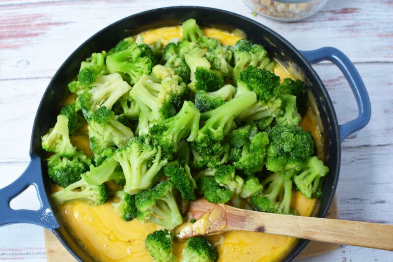 Adding Flour To Onion Mixture, Making A Roux, Onions in Frying Pan Adding the broccoli into the mixture