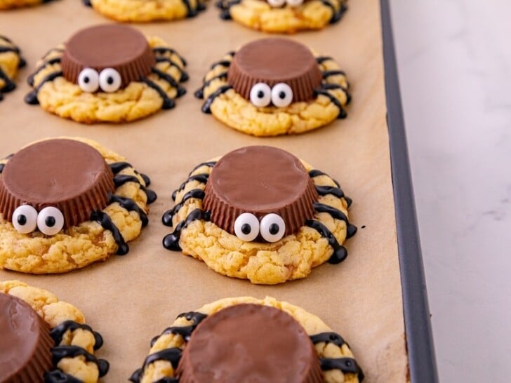 Adding the candy eyes to the cookie