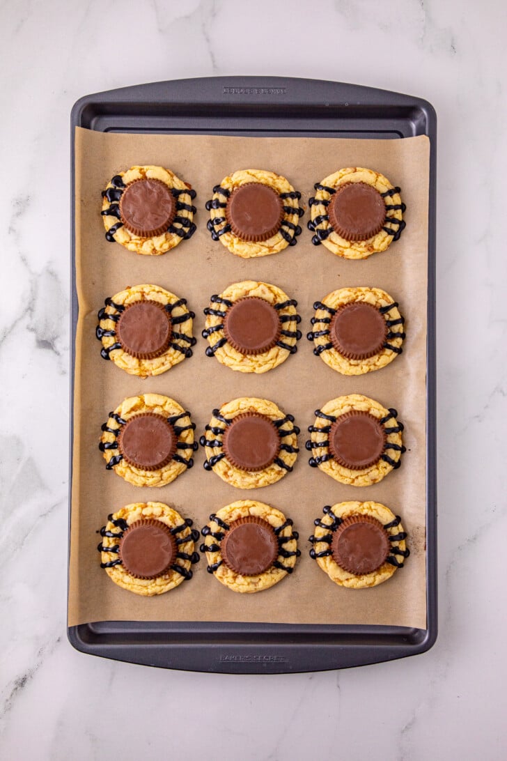 Pressing the peanut butter cup into the cookie